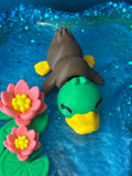 Duck and water lilies